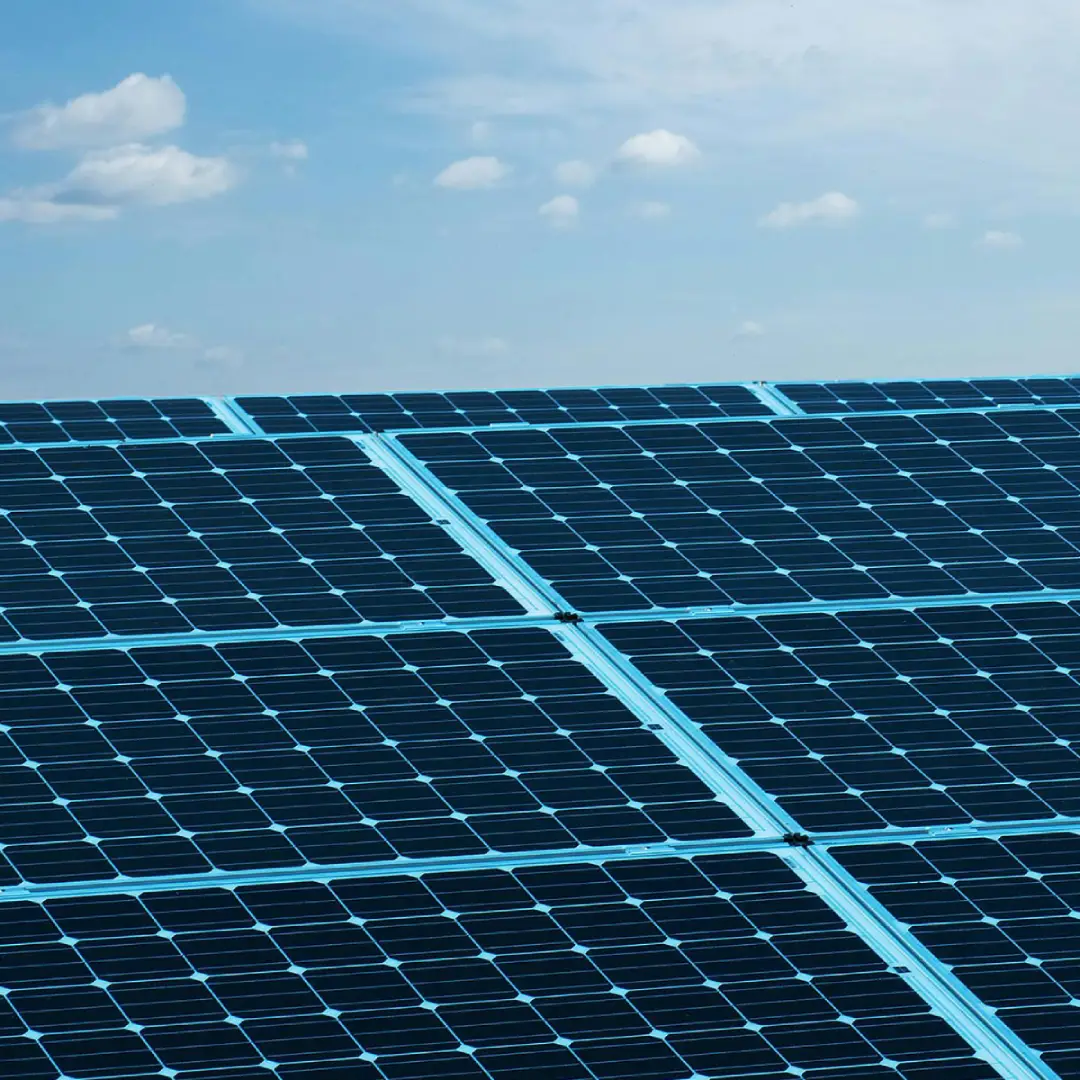 monocrystalline solar panels under blue cloudy sky