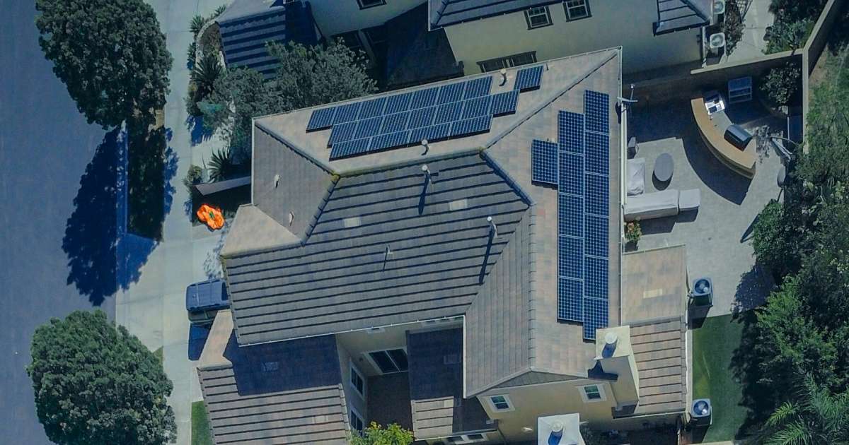 Monocrystalline solar panel installation on the roof of a UK home